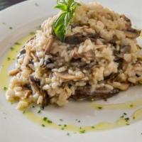 Risotto Funghi · Creamy medley of mushrooms, sherry wine and parmigiano, finished with truffle oil.
