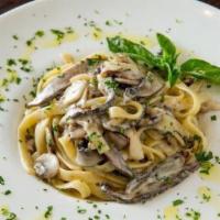 Fettuccini Funghi · Mixed mushrooms and creamy garlic sauce.