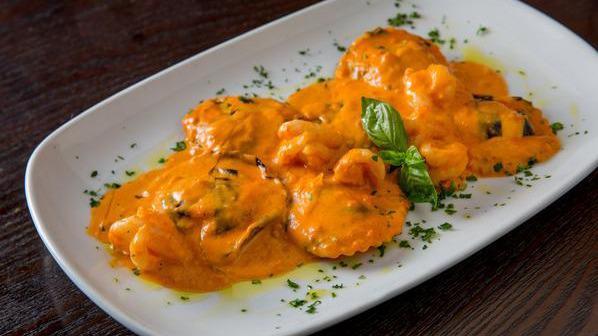 Lobster Ravioli · Served in a pink sauce with shallots and shrimp.