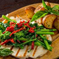 Pollo Alla Griglia · Marinated grilled chicken breast with broccoli rabe, sun-dried tomato, garlic and oil. Serve...