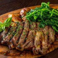 15 Oz. Rib-Eye Steak · 15 oz. seasoned grilled rib eye finished with olive oil and sea salt. Served with veggies an...