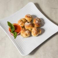 Garlic Knots (4 Pieces) · With a side of  Marinara Sauce