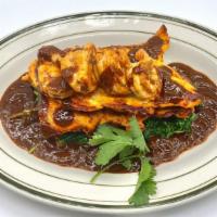 Grilled Chicken & Shrimp Mole Poblano Sauce · with saute spinach served with rice, beans , and tortillas.