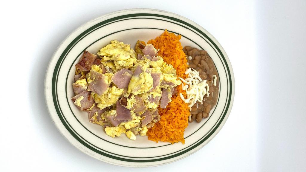 Huevos Con Jamon · Scrambled eggs with ham, served with rice and beans