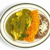 Huevos En Salse Verde · Scrambled eggs in green sauce, served with rice and beans