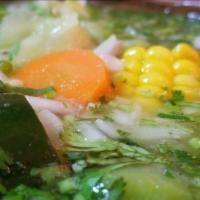 Sopa De Pollo · Chicken soup with vegetables. Served with rice, tortillas and bread.
