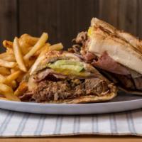 Cubano · Ham, fried pork, Swiss cheese, pickles, onion and dijon mustard. Served with French fries.