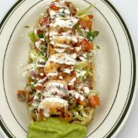 Huaraches · 1 oval-shaped tortilla filled with refried beans and topped with lettuce, pico de gallo, sou...