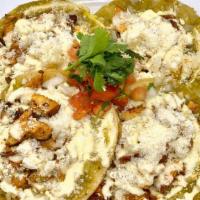 Chalupas · 3 fried tortillas topped with red or green sauce, sour cream, cotija cheese and onion. Add C...