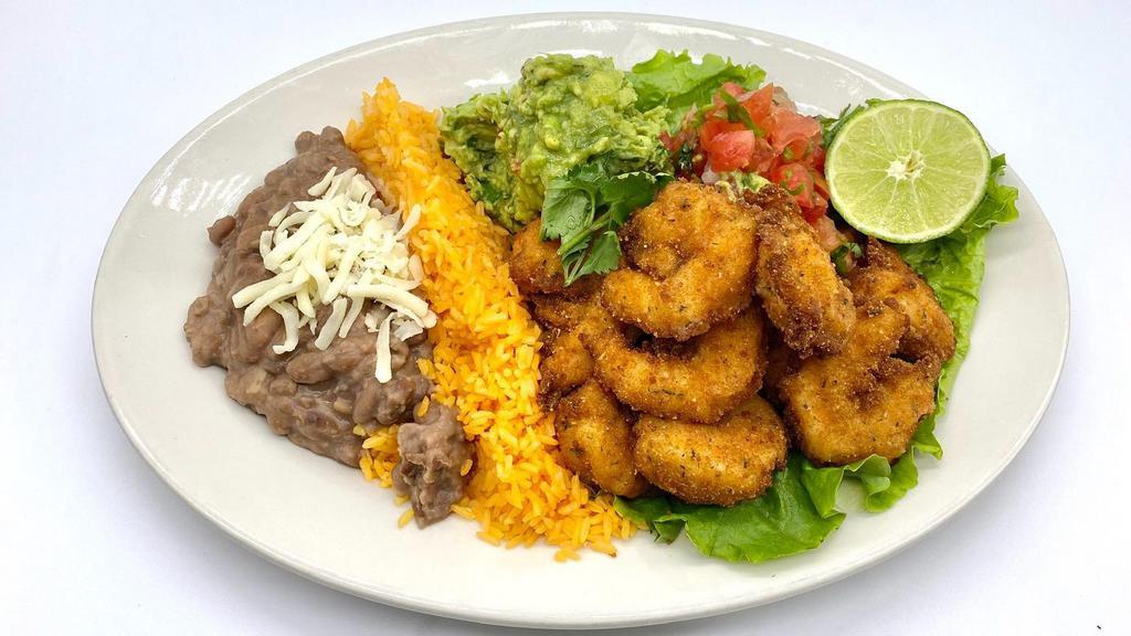Camarones Empanizados · Deep fried breaded shrimp. Served with rice, beans and tortilla.