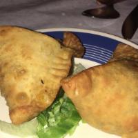 Samosa · Turnover filled with vegetable, coconut or meat.