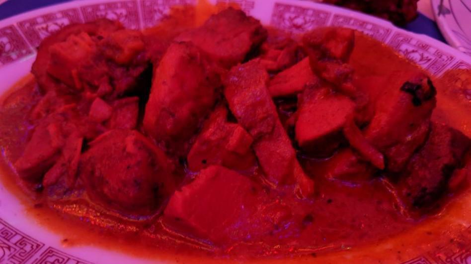 Chicken Tikka Masala · Boneless chicken cubes marinated in herbs and spices then barbecued over charcoal in the tandoori. Lightly spiced and cooked with onion and green peppers. Served with pilaf rice and house condiments.