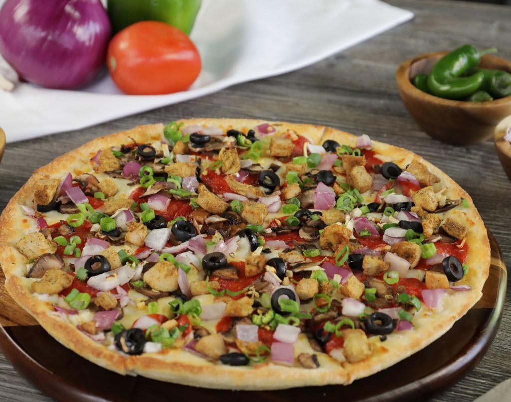 Halal Mediterranean Combo Pizza Twist · This pizza has our signature tandoori sauce, fresh diced mozzarella cheese, halal chicken, sliced halal lamb, fresh mushrooms, crisp red onions, sliced black olives, fresh cut; garlic, ginger & Green chilies, topped with garnished cilantro.