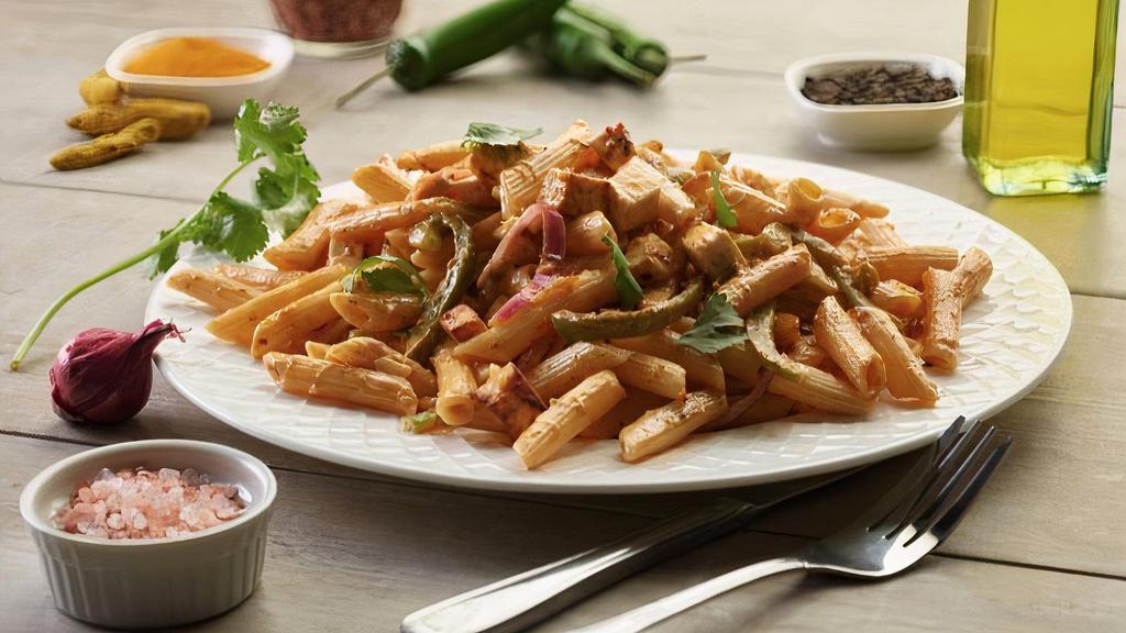 Shahi Paneer Pasta Twist · This pasta has our signature butter sauce, fresh sliced red onions, our masala paneer, fresh-cut; garlic-ginger & green chillies, garnished with fresh cilantro.