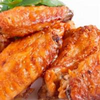 Chicken Wings · Crispy marinated wings w/ sweet chili sauce & sriracha