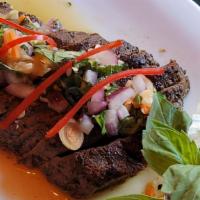 Grilled Beef Salad  · Grilled beef w/ cucumber, tomato, red onion, chili paste, rice powder in chili lime dressing