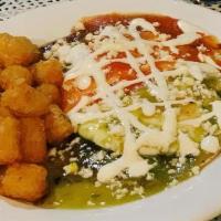 Huevos Rancheros · Black Beans, queso fresco and your choice of salsa