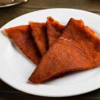Kategna · Toasted triangles of injera brushed with berbere and kibe.