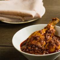 Doro Wett · Spicy. Ethiopian national dish made with chicken slow cooked in a spicy onion based stew. Se...