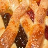 3 Fruit Lattice Torte · shortbread Cookie Crust with Cherry, Blueberry & Pineapple.