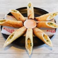 Flautas · Four Crispy Flour Tortillas Wrapped with Green Peppers, Corn, Choice of Chicken or Cheese an...