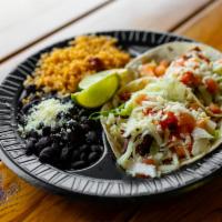 Taco Combo · Two Tacos Choice of Mexican Style o Gringo Style, Served with Rice, and Beans.
