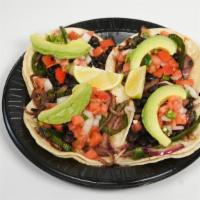 Tacos Veggie · Four Double Corn Tortilla Tacos with Beans, Veggie Mix ( Grilled Onions and Peppers), Pico d...