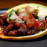 Un T Mexicano · One Double Corn Tortilla Taco with Choice of any Meat, Topped with Pico de Gallo and Avocado...