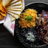 Steak & Onions · Steak and Grilled Onions Served with Rice, Beans. and Tortillas.