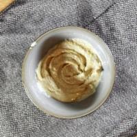 Hummus · Chickpeas puree and tahini sauce seasoned with garlic and olive oil.