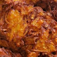 Onion Pakora  · Sliced onion dipped into our masala batter & fried. Served with 