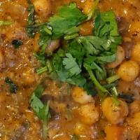 Channa Masala (Chick Peas) · Chick peas sautéed with onions and fresh bell peppers. Side of basmati rice & raita