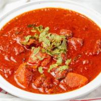 Vindaloo (Spicy Curry) · Your Choice  in a spicy curry. Side of basmati rice & raita. Spicy!