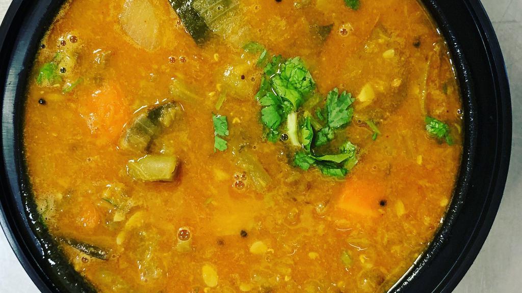 Sambar (Mix Veg Stew) · prepared with a tamarind-based broth, lentils, and vegetables. Served with basmati rice & raita.