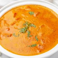 Chicken Tikka Masala · Tender boneless chicken grilled in Tandoor and then cooked in thick tomato, green pepper, on...