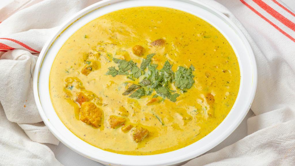 Chicken  Korma · A classic dish cooked with almonds, cashew powder and a touch of cream. Served with basmati rice & raita.