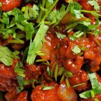 Chilli Chicken · Chicken breast cubes tossed with tomato based sauce, onion, bell pepper and garlic. Served w...