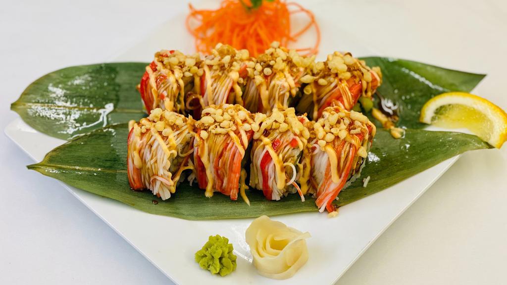 Lobster Roll · Spicy Lobster Salad, Cucumber, Avocado, Masago Topped with Imitation Crab, Spicy Mayo, Sushi Sauce, Crispy Onion, Tempura Batter Wrapped with Soy Paper.
