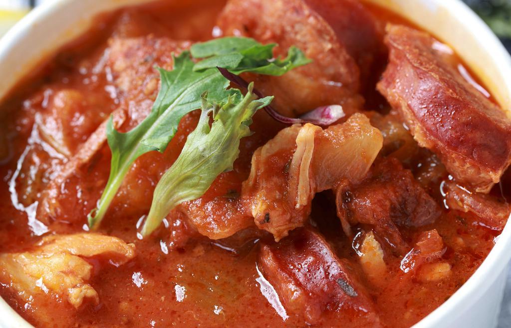 Bowl Of Jambalaya · A hearty chicken and andouille sausage stew served with rice.