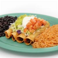 Chicken Taquitos (4) · Shredded chicken in a corn tortilla, fried and topped with sour cream and guacamole.