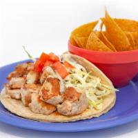 Grilled Fish Tacos · Shredded cabbage and tomatoes with jalapeño cilantro aioli.