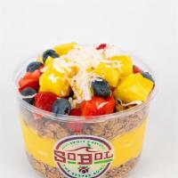 Mango-Pineapple Bowl · We blend mango, pineapple and banana with coconut milk to make a thick fruit smoothie. We th...