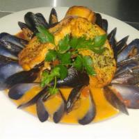 Moules Marinieres · Mussels with White wine, garlic, bacon, tomatoes and butter