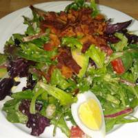 Cobb Salad  · Mesclun greens, tomatoes, crispy bacon, hard boiled eggs, avocados, crumbled blue cheese and...
