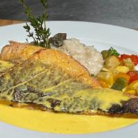 Pan-Seared Branzino Served With Creamy Risotto, Asparagus And Saffron Sauce · Served with creamy risotto, roasted asparagus, and saffron sauce
