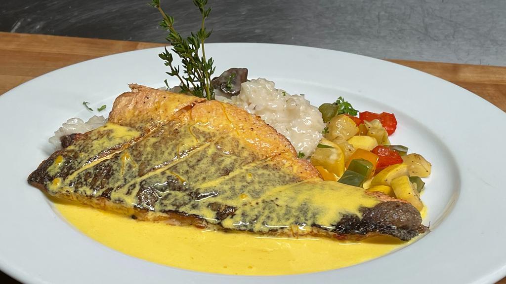 Pan-Seared Branzino Served With Creamy Risotto, Asparagus And Saffron Sauce · Served with creamy risotto, roasted asparagus, and saffron sauce