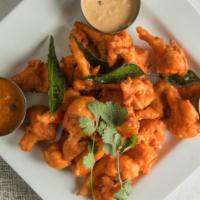 Kaavi Poo Varuval · Hot & spicy. Spicy batter fried cauliflower with curry leaf flavour.