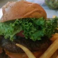 Beef Burger Deluxe · Served with lettuce, tomato, pickle and French fries. Served on a hamburger bun.