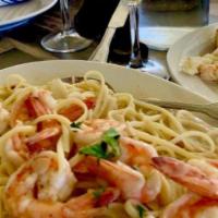 Shrimp Scampi · Over linguine with garlic butter, white wine parsley.