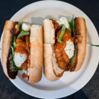 Vodka Chick'N Parm Sandwich · three fried chick'n tenders, parmesan cheese topped with vodka sauce, ricotta, and fresh bas...